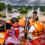 Rescue teams evacuating residents from flood-affected areas in Assam as severe monsoon flooding continues.