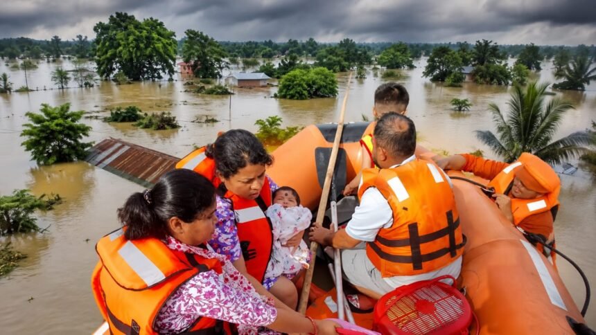 Rescue teams evacuating residents from flood-affected areas in Assam as severe monsoon flooding continues.