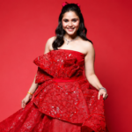 Muskan Bamne wearing a glamorous red gown for an exclusive fashion photoshoot.